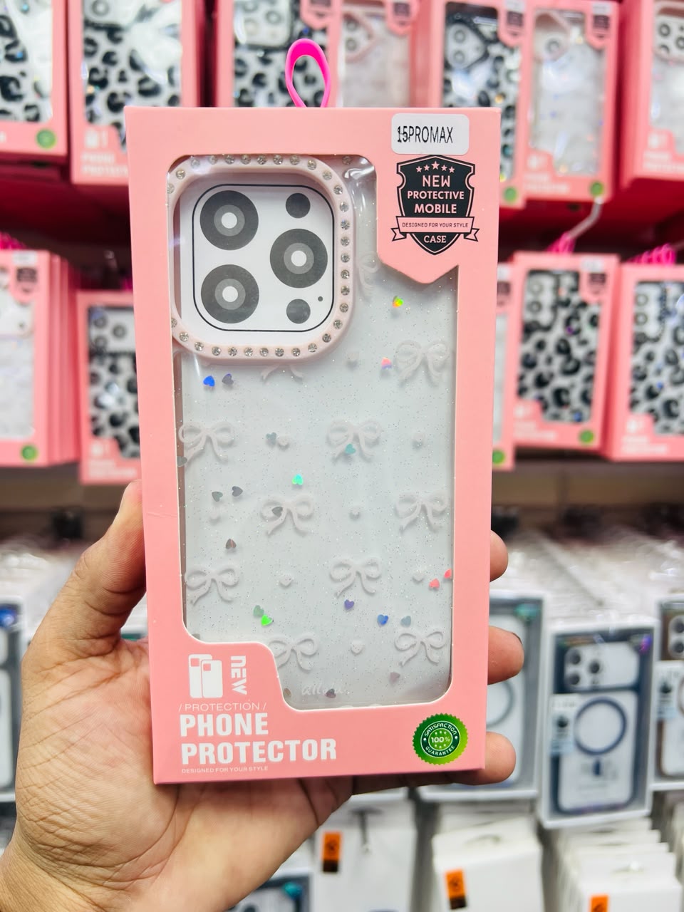 Caseit Bow Crystal Luxe Case for iPhone with glitter hearts, bow pattern, rhinestone border, and shockproof protection