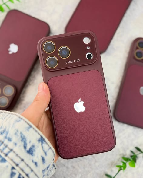 Premium burgundy leather style phone case with textured back and raised camera protection