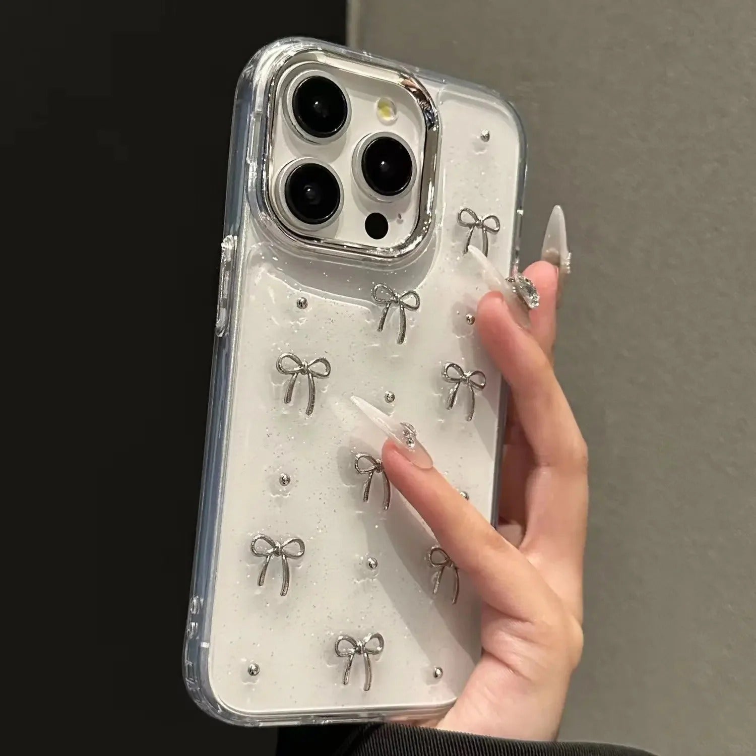 Cute silver bow glitter iPhone case with 3D silver bows and clear protective edges